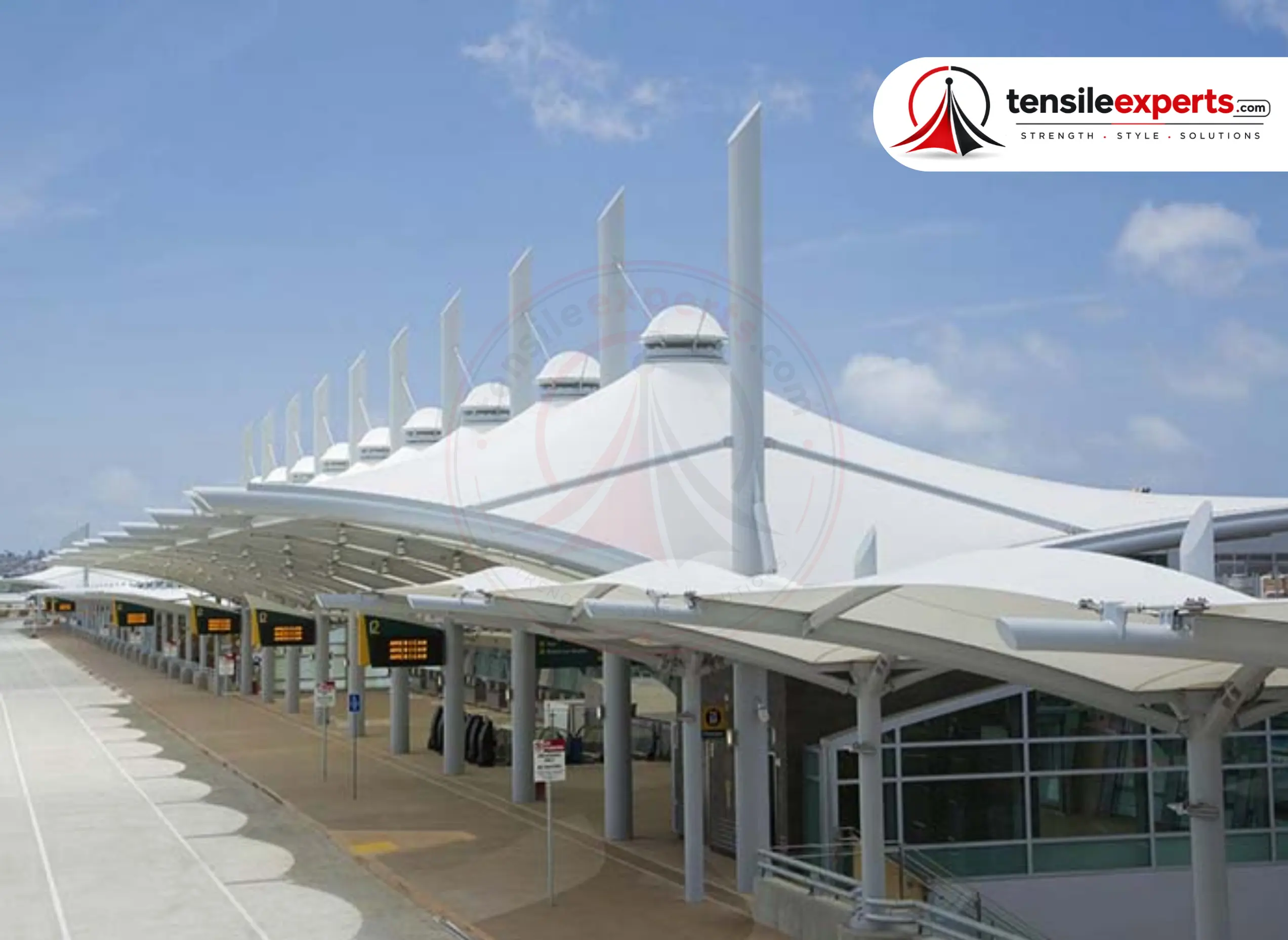 A public-infrastructure-grade tensile canopy at a terminal curbside — the same continuous, high-footfall durability a forecourt canopy needs.