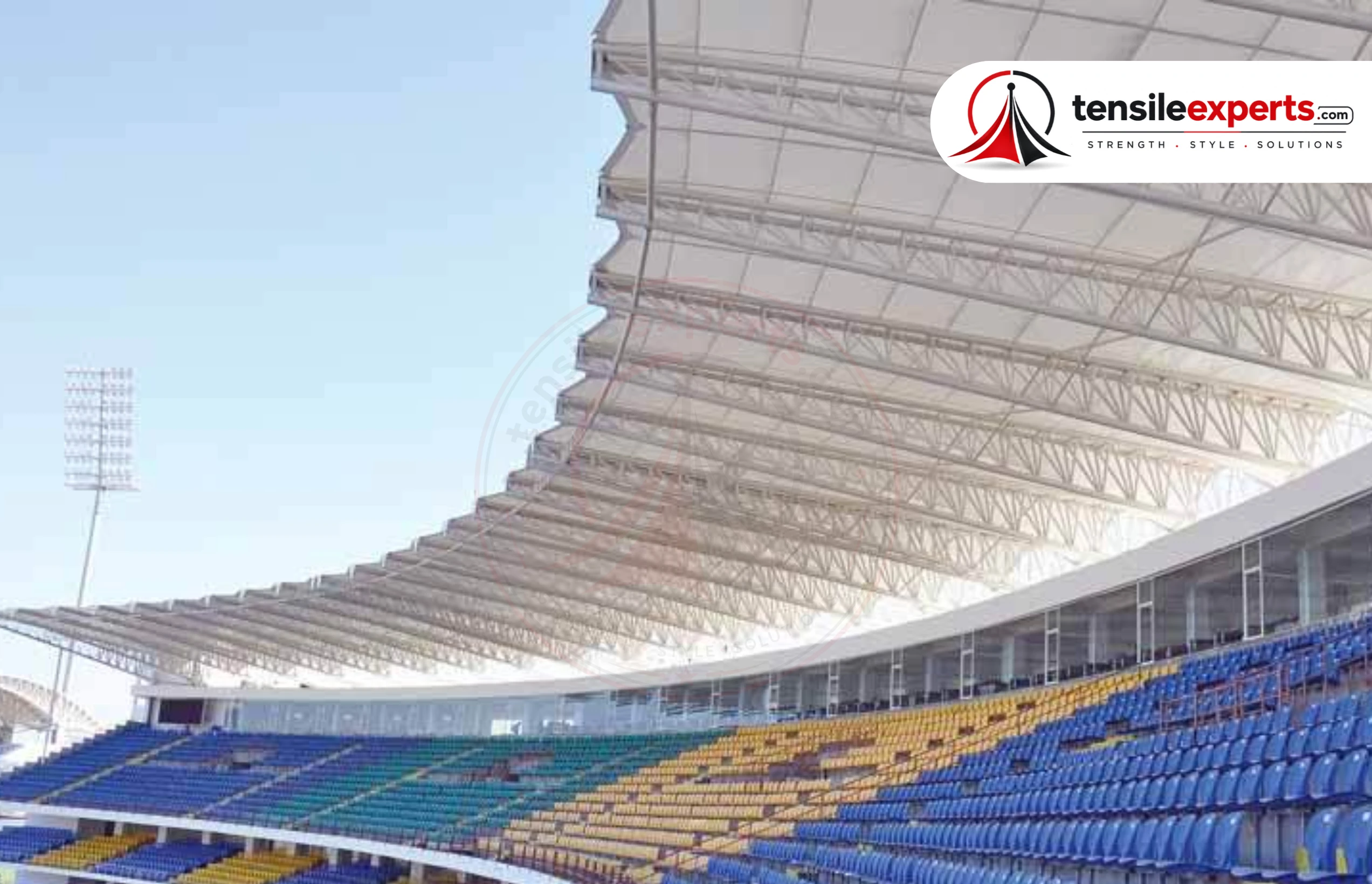 A tensile roof structure over a sports court — the same structural approach scales down for badminton court coverage.