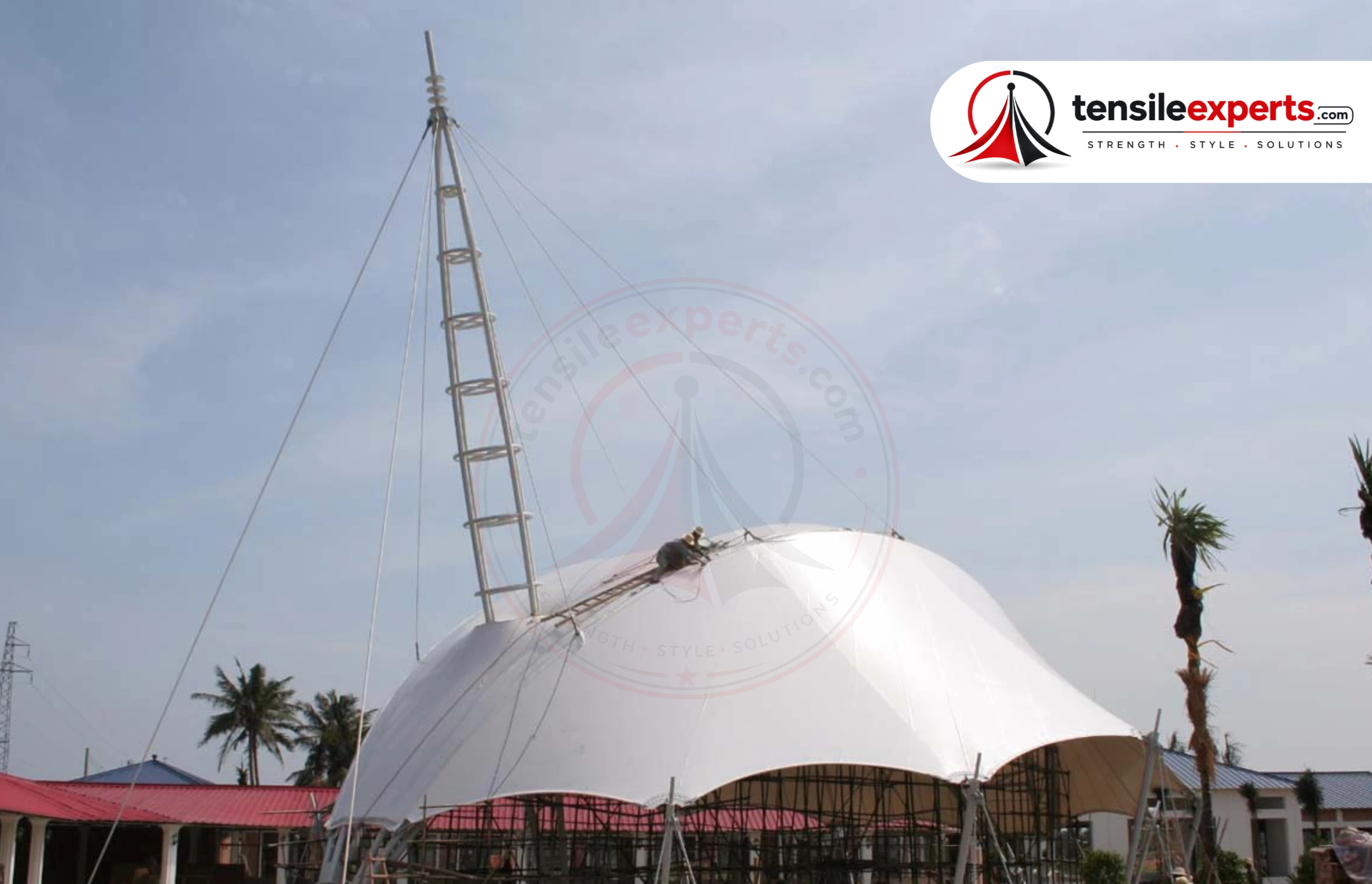 A tensile dome structure — a rounded, column-light architectural centerpiece.