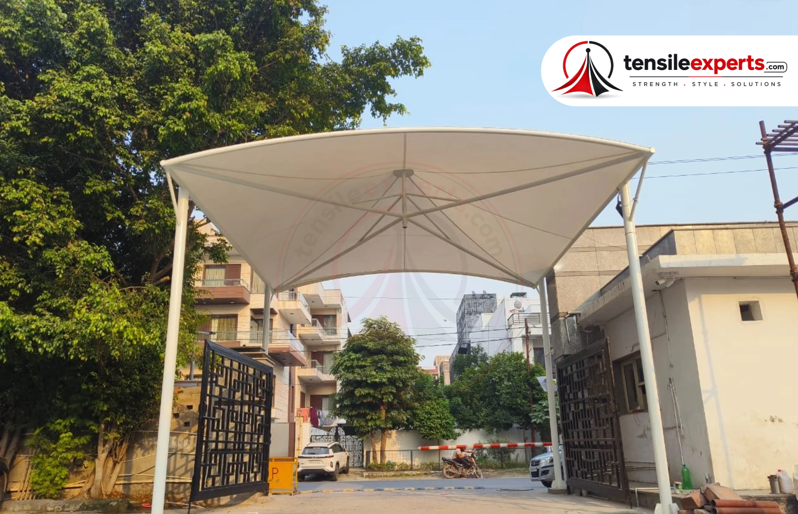 A tensile entrance structure — a common request for Noida residential societies wanting an entrance that matches the building's architecture.