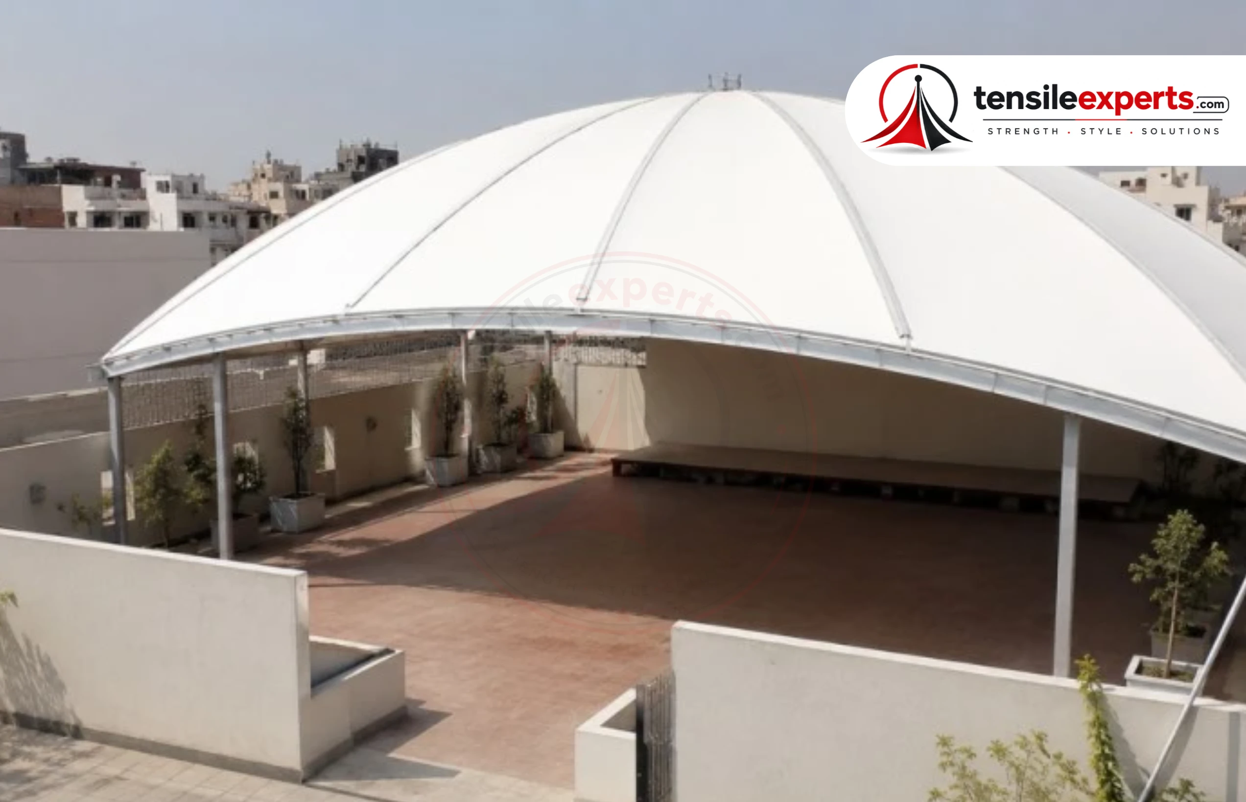 A large-span tensile roof — the kind of coverage that suits an atrium, walkway connection, or parking structure on a corporate campus.
