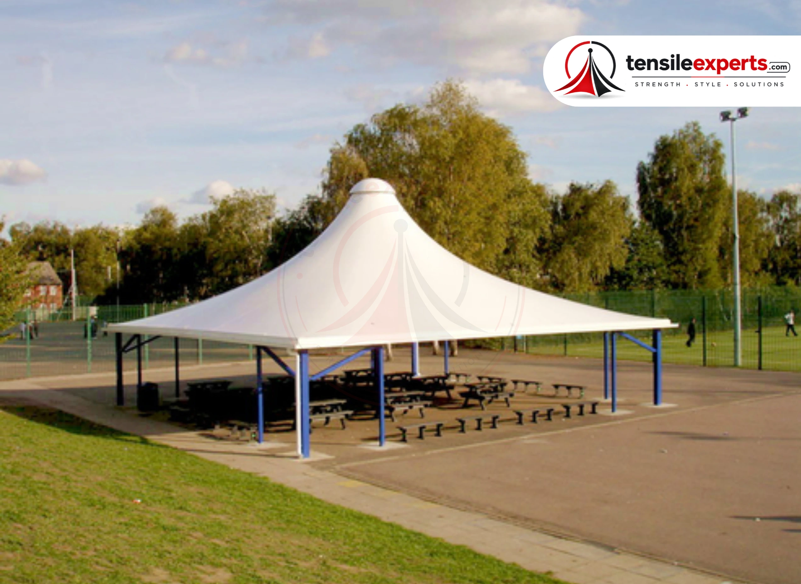 Modern building entrance canopy over parking