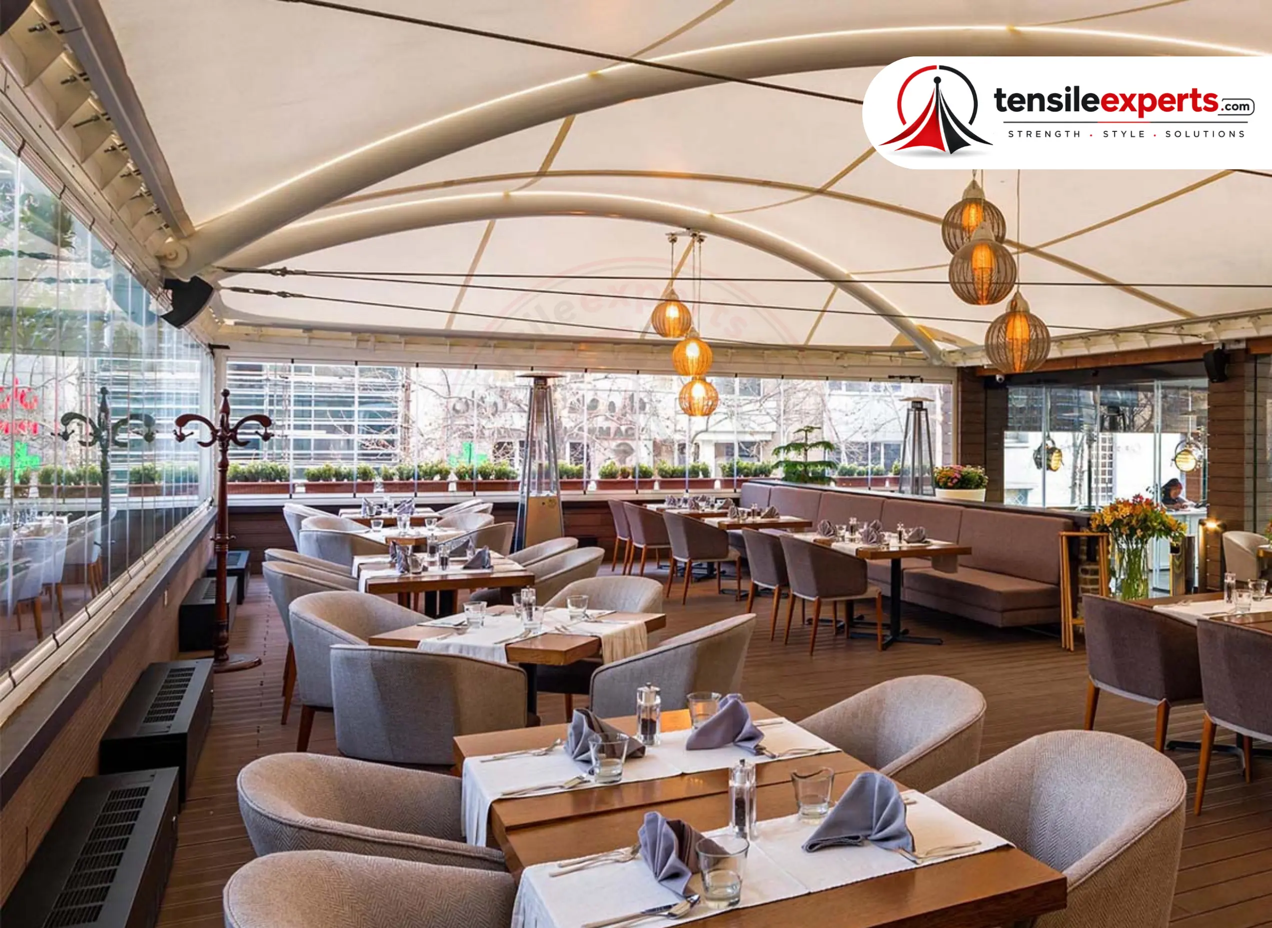 Retractable canopy over a rooftop restaurant terrace