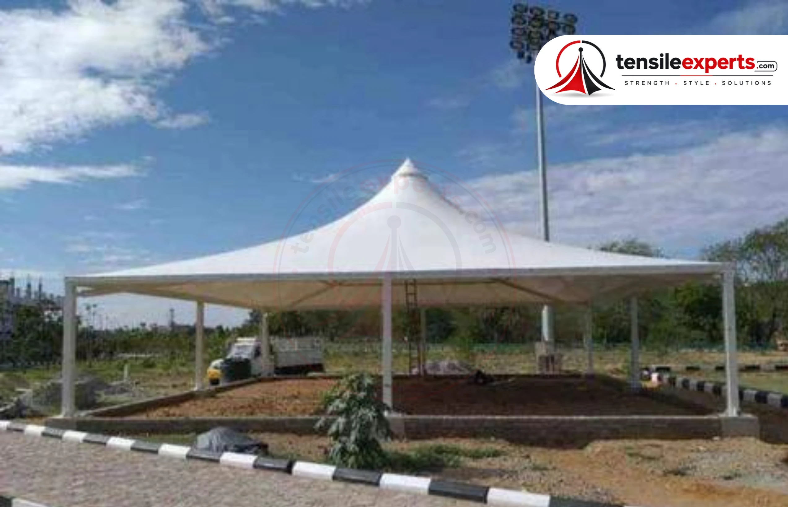 Row of cantilever tensile canopies at an industrial site