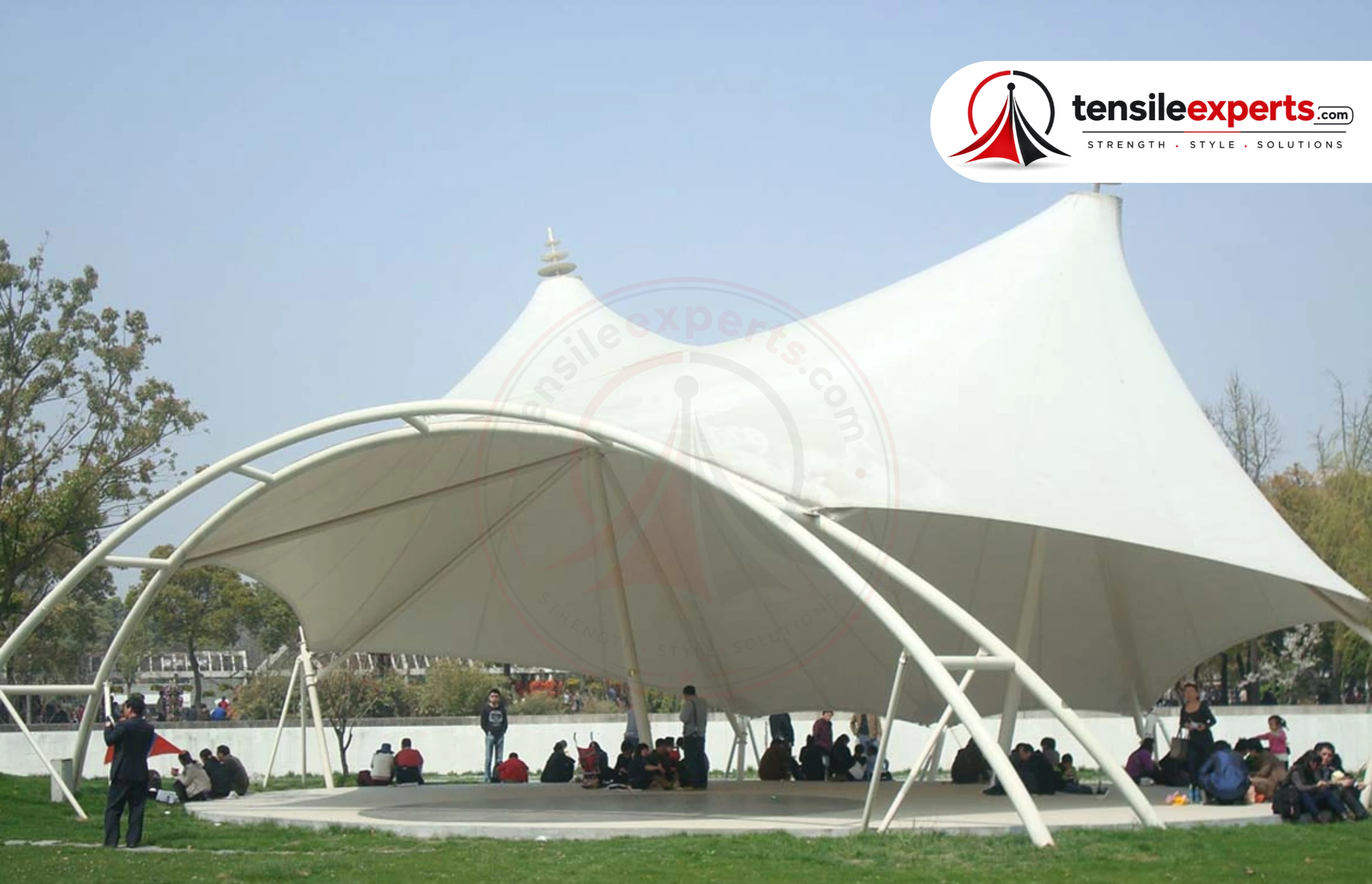 Tension-based design carries load across a curved surface more efficiently than a flat roof carries the same load through bending.